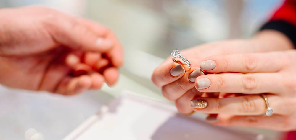 person holding engagement ring